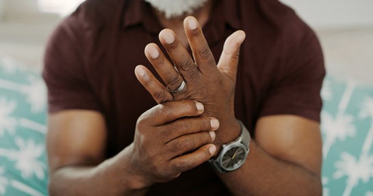 Man suffering with arthritis pain in hand